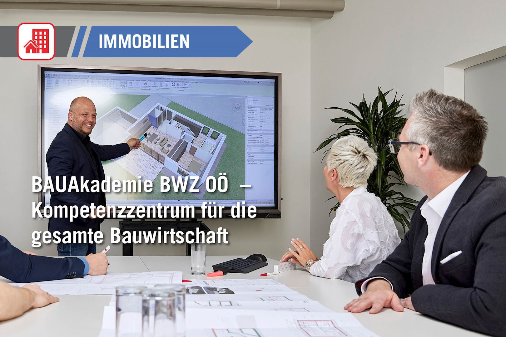 2 Männer und eine Frau besprechen den digitalen Bauplan 